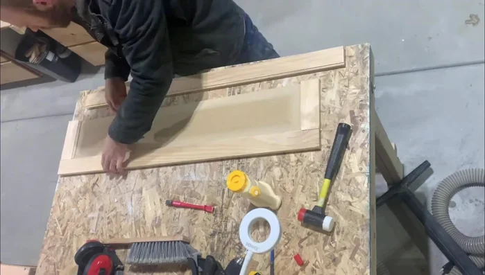 Sand and paint the door.