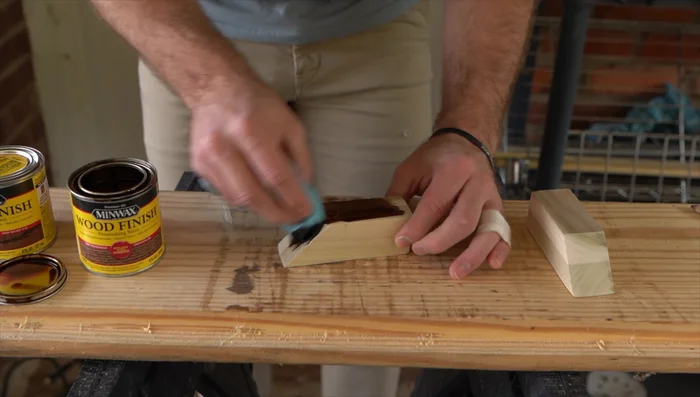 Apply wood stain to the sanded pieces and let them dry for 24 hours.